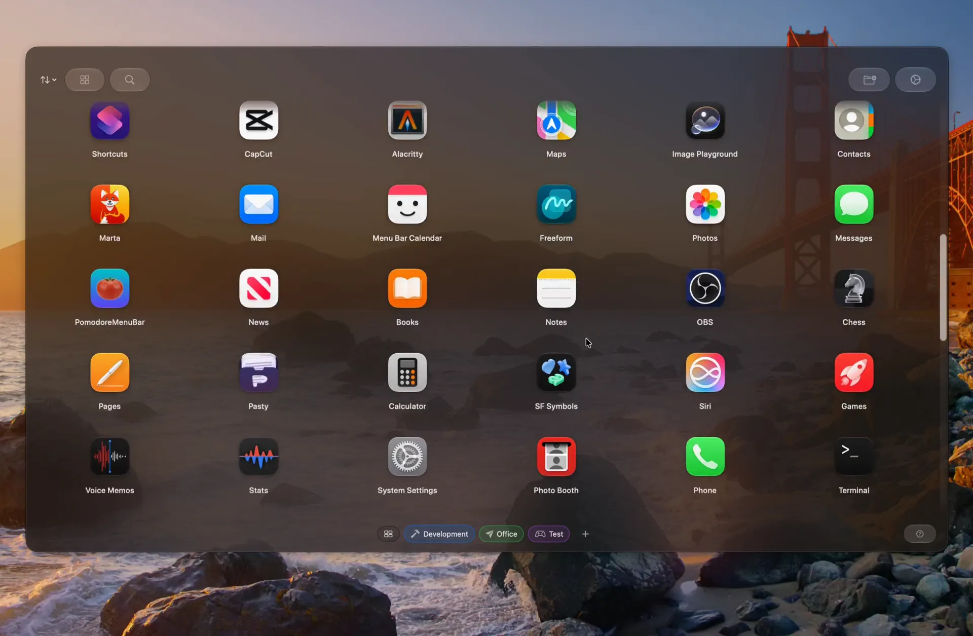 Launchie open over a Mac desktop, showing a grid of apps with folders and Spaces